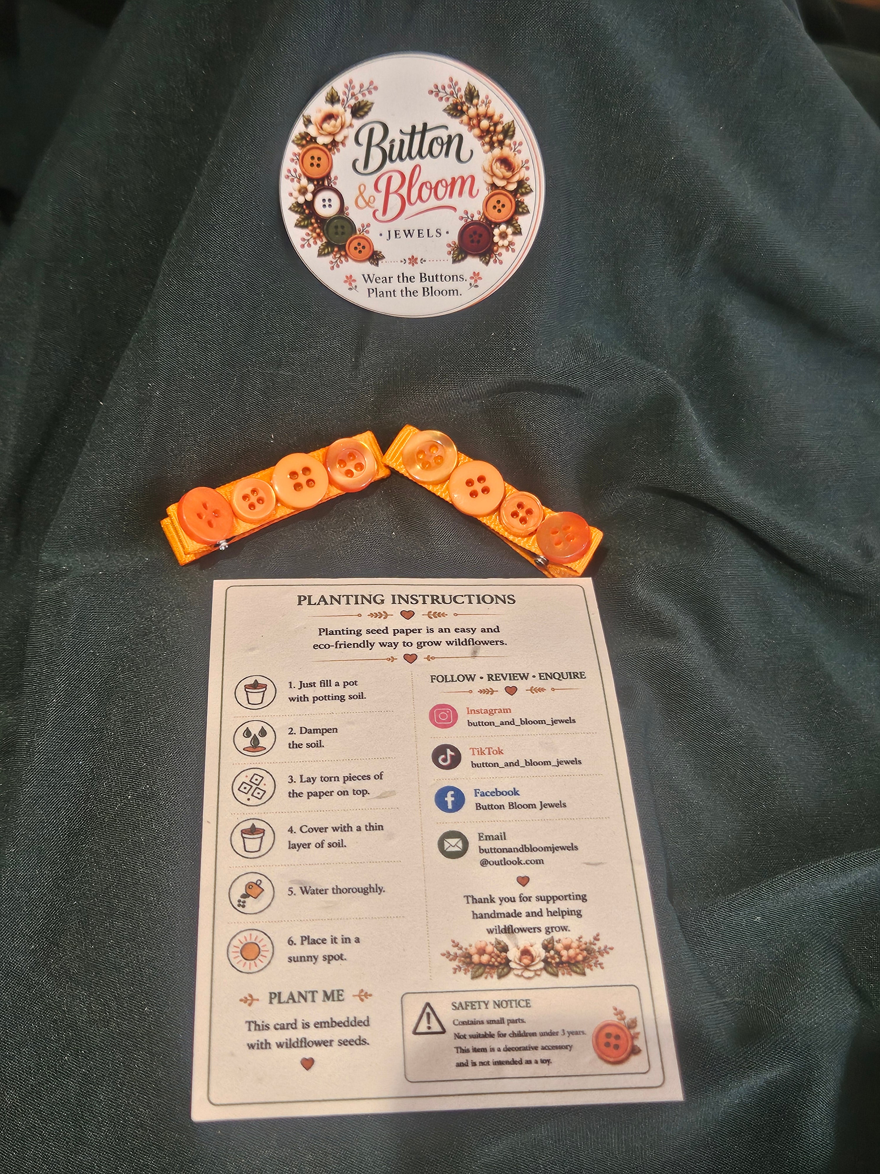 Orange recycled button alligator clips lined with ribbon
