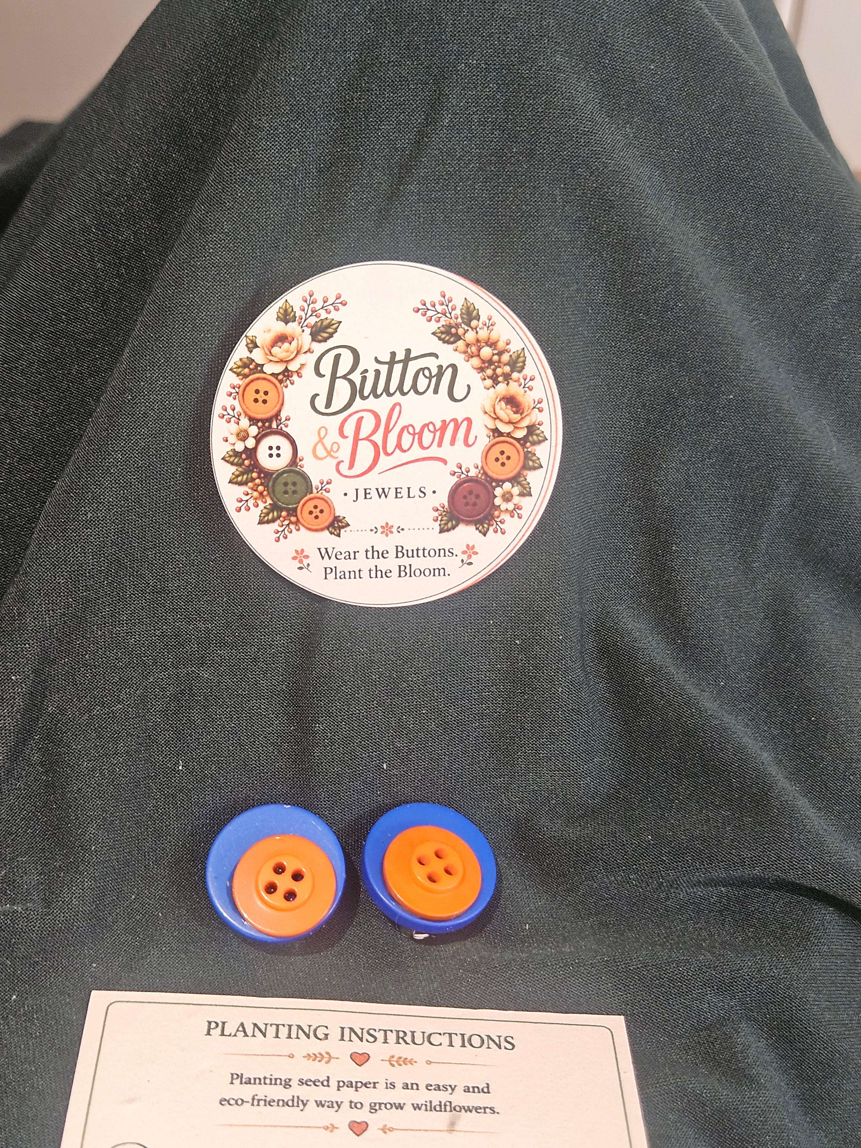 One of a kind double button clip on earring, blue and orange.